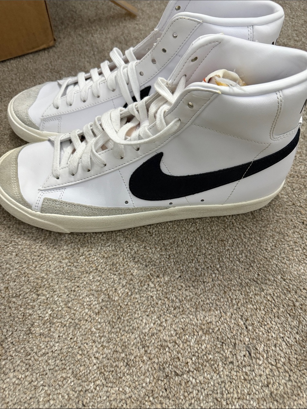Nike White High-Top Sneakers with Black Swoosh
